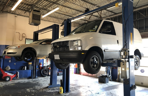 Two Brothers Total Car Care Garage with cars